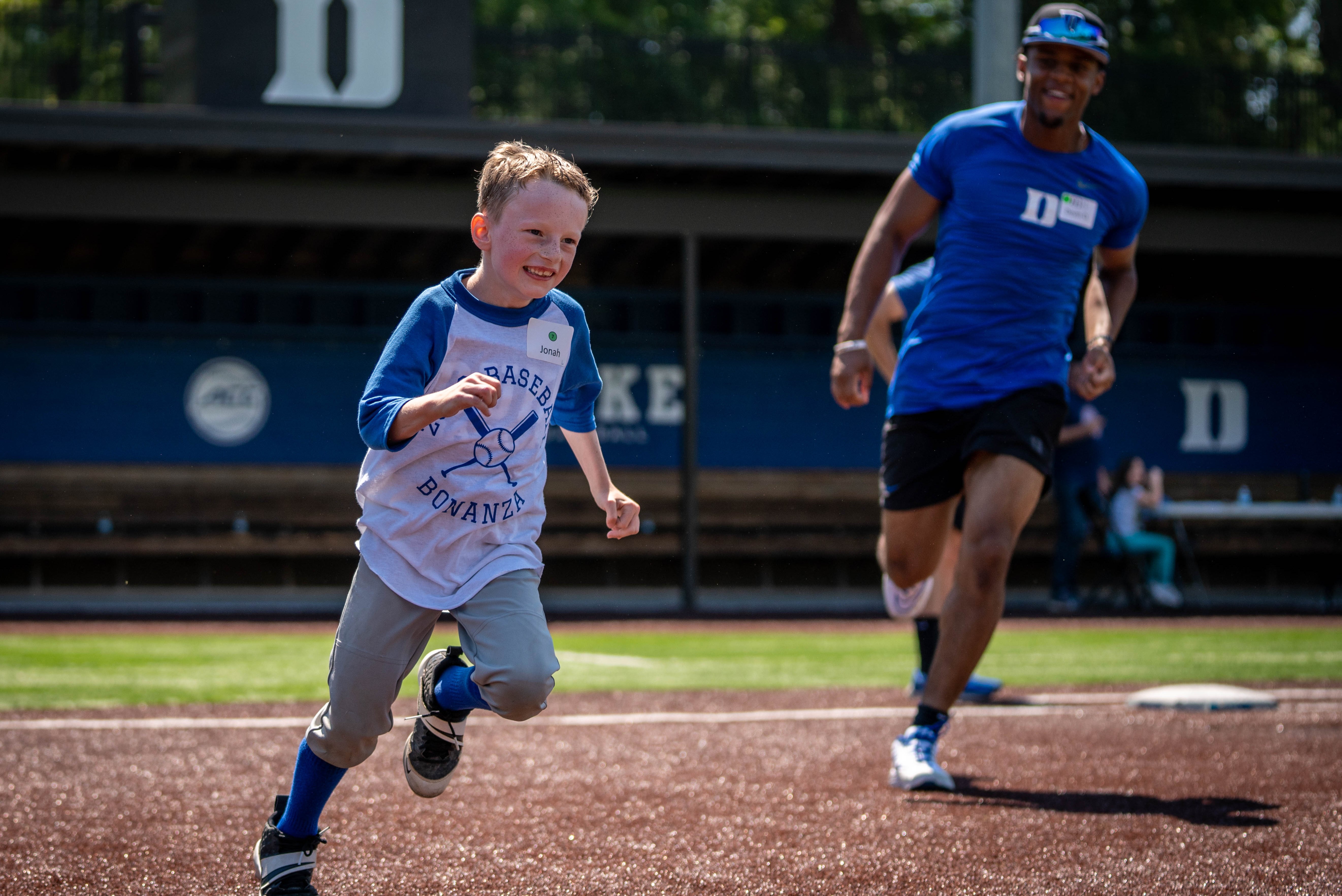child running on baseball field